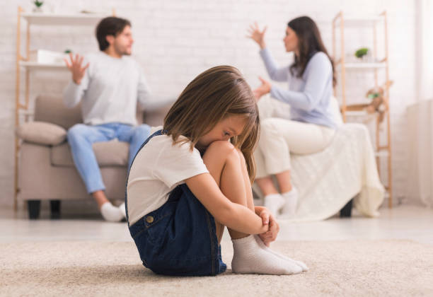 family conflict. little girl crying after parents quarrel at home - surprise child little girls shock imagens e fotografias de stock