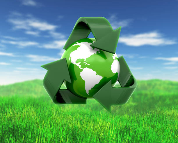 3D render of a globe with recycling symbol on grass and sky landscape