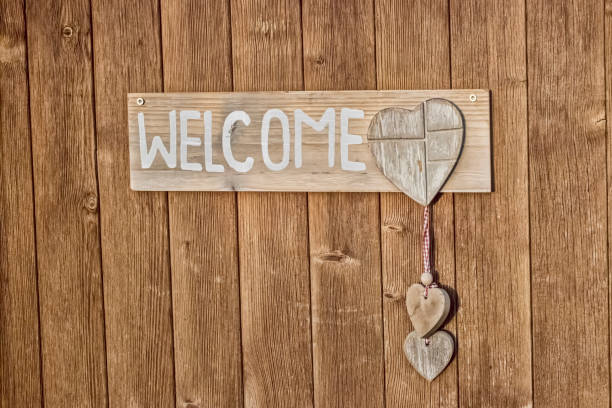 istock Welcome Shield on a wood door 1205276026