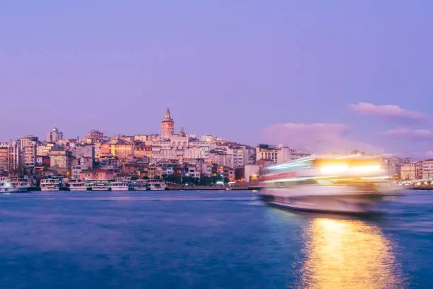 Galata Tower with Ferry Boat in Golden Horn , Istanbul, Turkey,