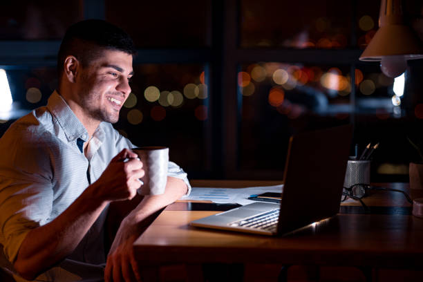istock Business Guy At Laptop Having Coffee Sitting At Workplace 1205278102