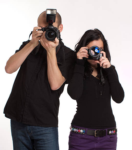 Studio shot of a stylishly dressed young woman holding a vintage camerahttp://195.154.178.81/DATA/i_collage/pi/shoots/805527.jpg