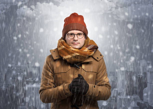 istock Boy freezing in cold weather with city concept 1205280097