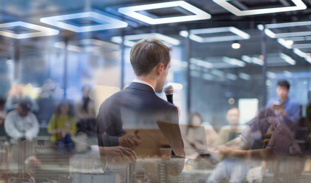 istock Team work process. Marketing strategy brainstorming. Paperwork in open space. Meeting concept in office between colleagues. Coaching concept during teamwork between managers and entrepreneurs. 1205281041