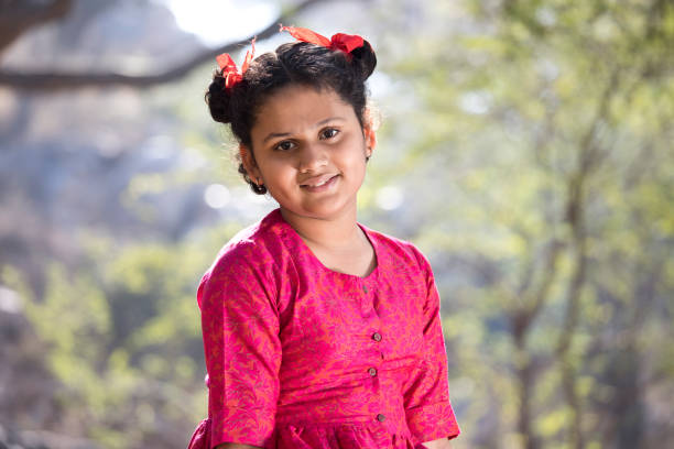 istock Smiling girl at park 1205281083