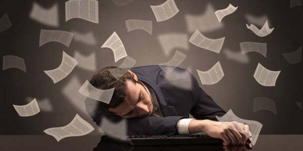 istock Businessman fell asleep at the office with paperwork concept 1205281212