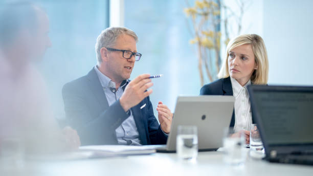 istock Business people having meeting in conference room 1205281213