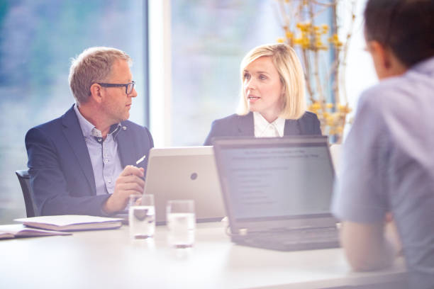 istock Business people having meeting in conference room 1205281219