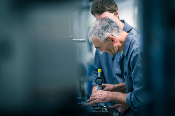 istock Male workers working in factory 1205281235