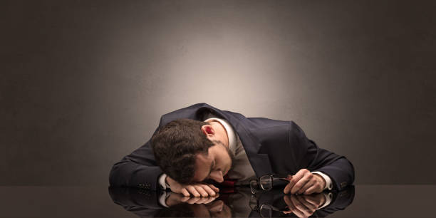 istock Businessman fell asleep at his workplace 1205281401