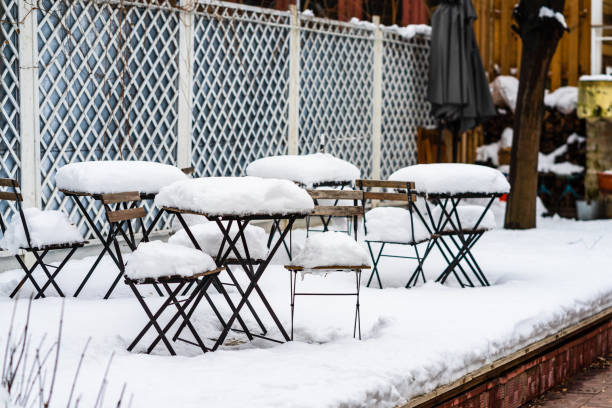 istock Perfectly shaped snow on table and chairs, covered with snow. 1205281599