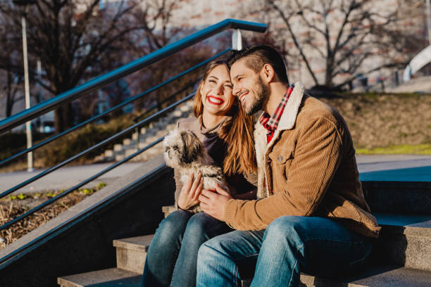 istock Young couple enjoying nice weather with their dog 1205282188