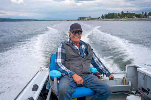 istock Happy fisherman at sea 1205283897