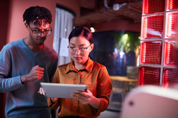 istock Two Young Business People in Futuristic Interior 1205285324
