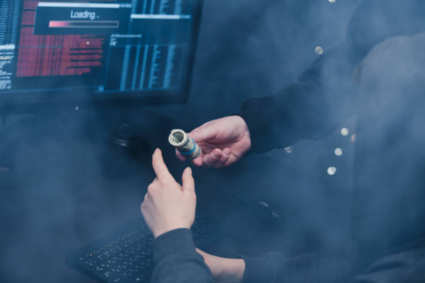 istock The hacker offers his partner to take money from him for developing new viruses and programs for cracking passwords. 1205285800