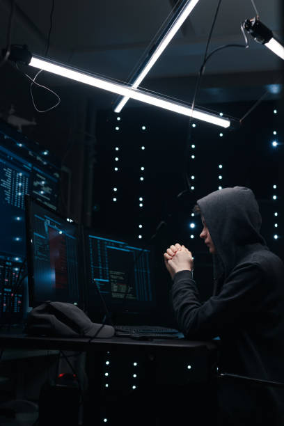 istock Hacker is tensely waiting for the result of hacking the security system 1205285898