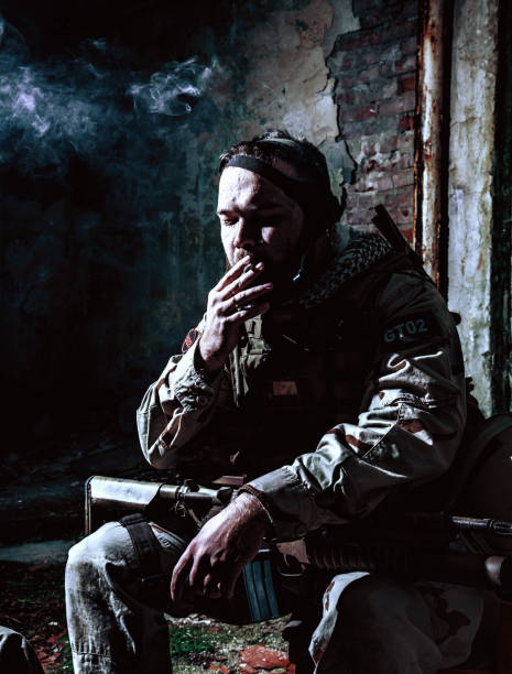 istock Tired commando soldier smoking after intensive firefight 1205285966
