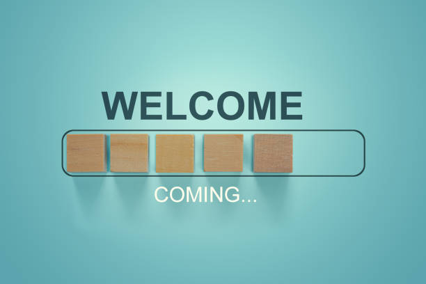 istock The word WELCOME with wooden blocks in loading bar progress. 1205285998