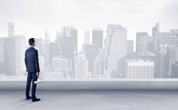 istock Businessman looking at a big city panorama 1205286034