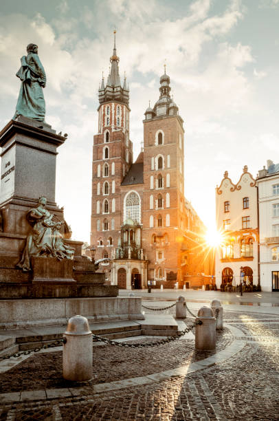 Adam Mickiewicz monument and St. Mary's Basilica on Main Square in Krakow, Poland