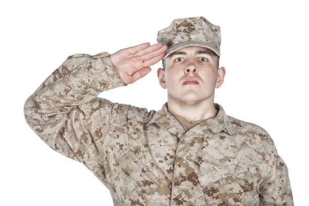 istock Saluting and smiling army soldier studio shoot 1205286106