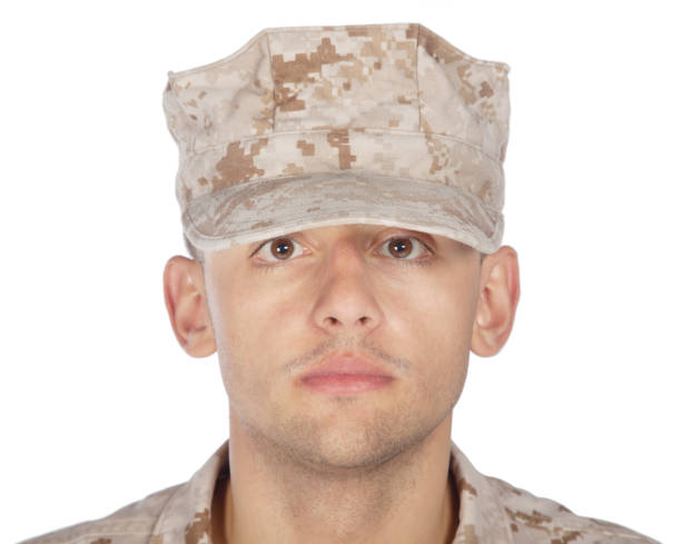 istock Saluting and smiling army soldier studio shoot 1205286112