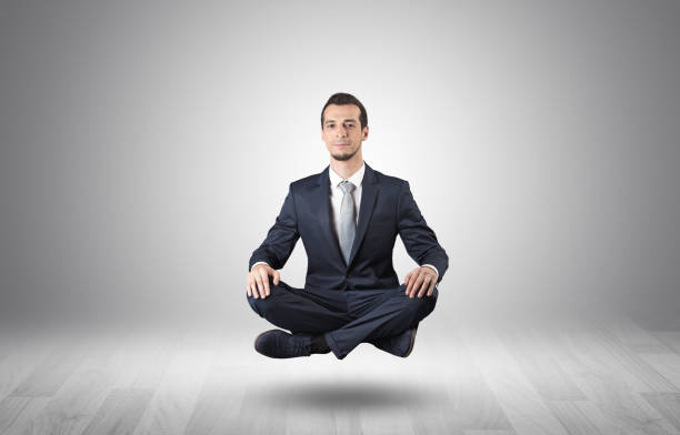 istock Businessman meditates in an empty space concept 1205287979