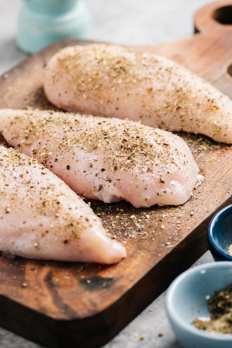 Seasoned raw chicken breasts ready for grilling in Frederick, MD, United States