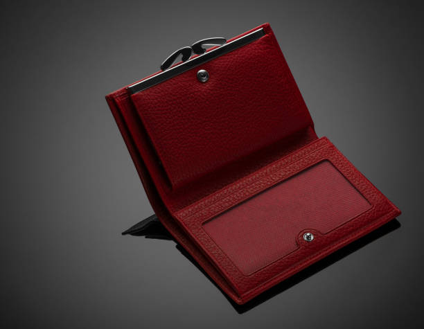 istock women's wallet on a black background 1205289096