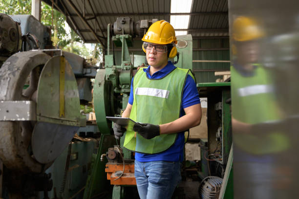 istock Male Asian inspector, engineer working  in the production line process in factory 1205289976