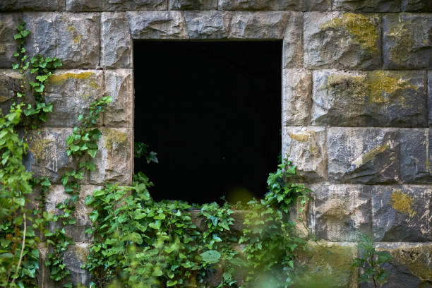 istock Black square hole in the wall of the building 1205291477