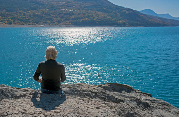 istock Man at Lake Serre Poncon 1205296577