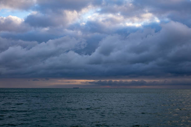 istock blue dark cumulus stormy clouds above the sea 1205296690