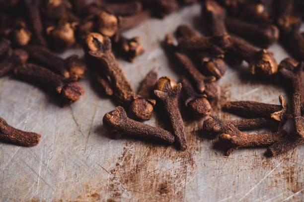 istock Dry cloves spices on the dark rustic background 1205296702