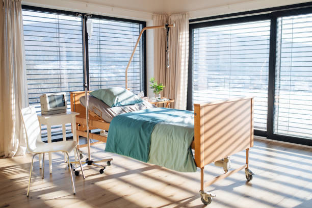 istock Empty, adjustable bed in room in private modern hospital. 1205296738