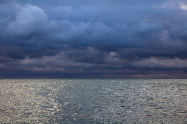 istock blue dark cumulus stormy clouds above the sea 1205296987