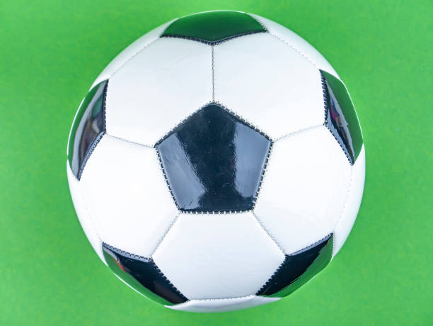 istock Soccer ball on a green background. 1205297253