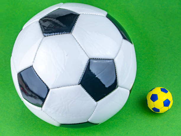 istock Soccer ball on a green background. 1205297267