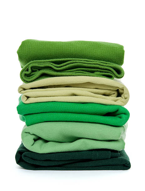 Pile of green folded clothes stock photo