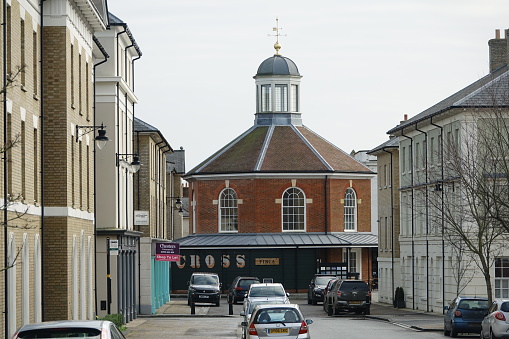 Poundbury, Dorchester Dorset England. February 2020. New Town created by Charles Prince of Wales. Looking down a wide street towards the Round  building which  is the  Butter Cross. A focal point of the town.