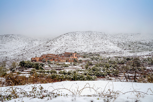 Remote Berber village after snow fall in Atlas mountains, Morocco