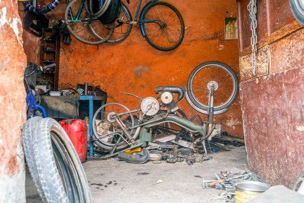 istock Broken motorbike in messy orange garage in Morocco 1205298971