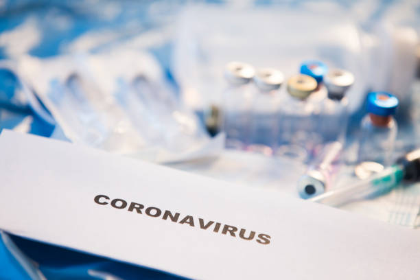 istock Coronavirus vaccines bottles medical background 1205299117