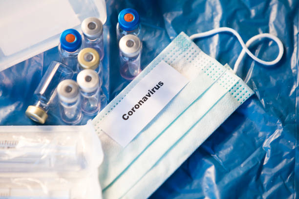 istock Coronavirus vaccines bottles medical background 1205299258