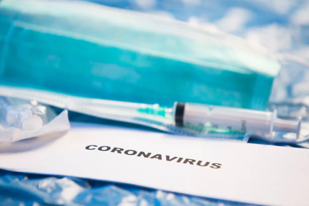 istock Coronavirus vaccines bottles medical background 1205299883