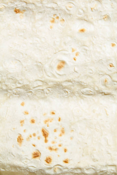istock light wheat pita bread with toasted. close up top view 1205300087