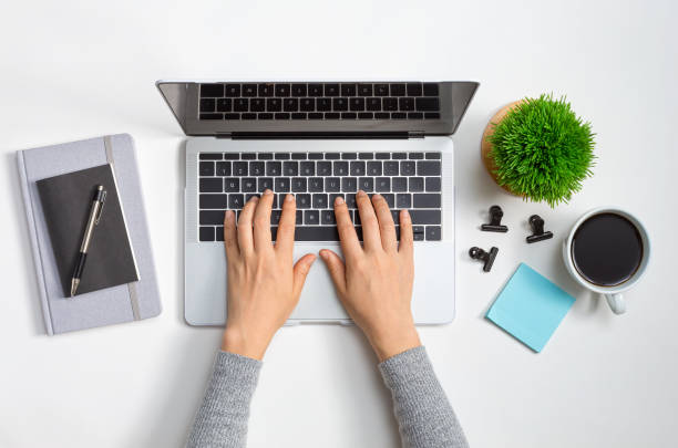 istock Laptop workstation with office supplies 1205300759