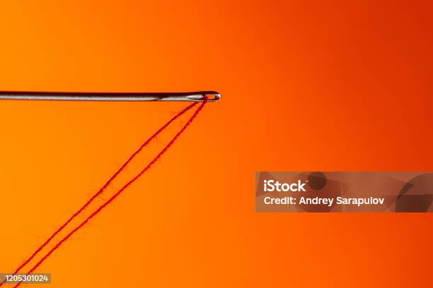 Needle With Red Thread On Red Background Stock Photo - Download Image Now - Sewing  Needle, Sewing, Embroidery - iStock