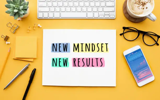 Photo of New mindset new results concepts with text on notepad on desk. positive thinking