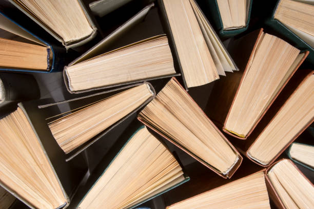 istock Old and used hardback books or text books from above. 1205301851